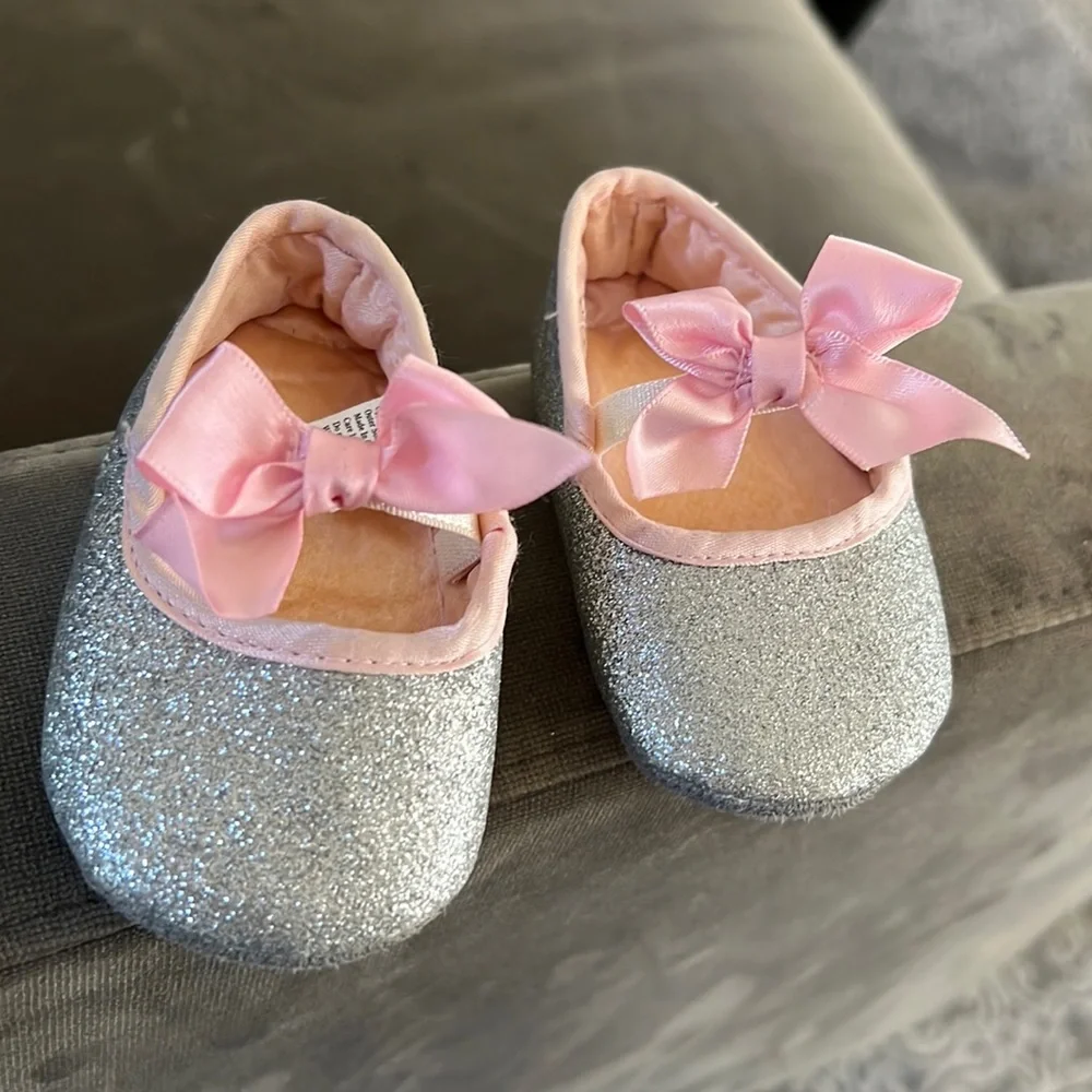 Silver flat shoes with pink bows. Baby Girl Size 1